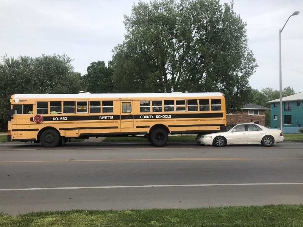 Car was rear ended and pushed under a Fayette County school bus.