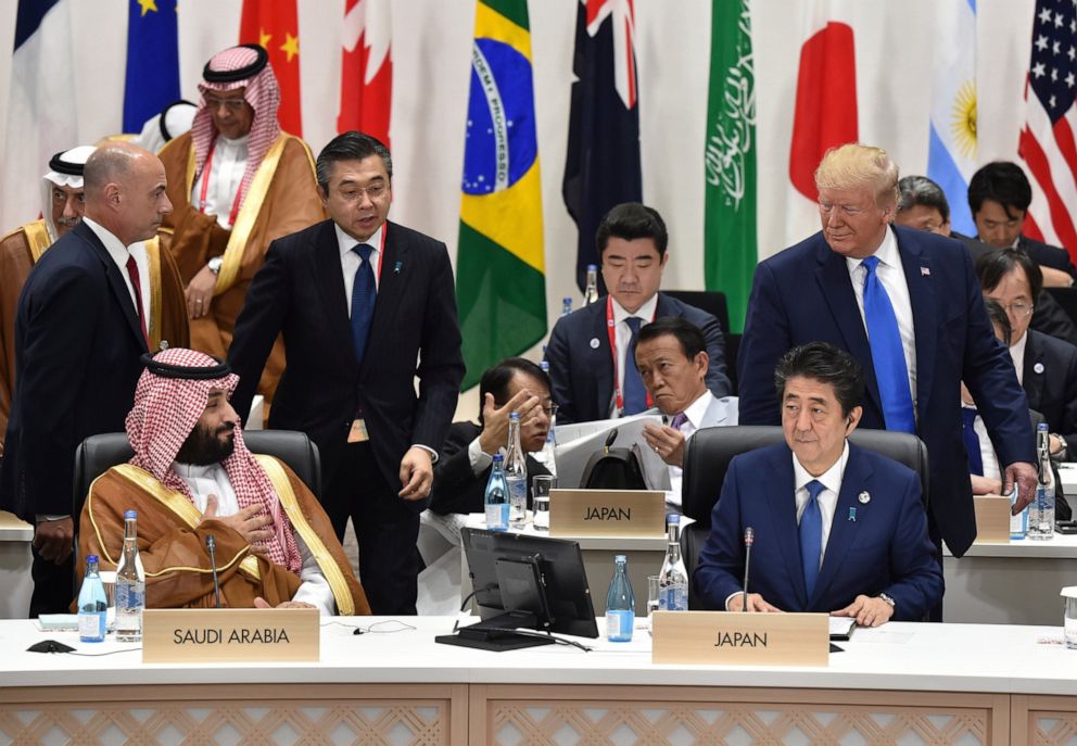 PHOTO: U.S. President Donald Trump, right, looks back at Saudi Arabias Crown Prince Mohammed bin Salman, left, as Japans Prime Minister Shinzo Abe, right bottom, looks on at the G-20 Summit in Osaka Saturday, June 29, 2019.