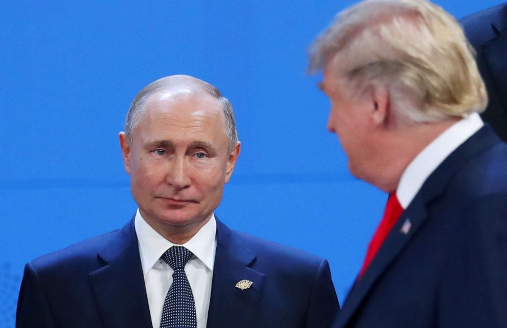 PHOTO: President Donald Trump and Russias President Vladimir Putin cross paths during the G20 leaders summit in Buenos Aires, Argentina, Nov. 30, 2018. 