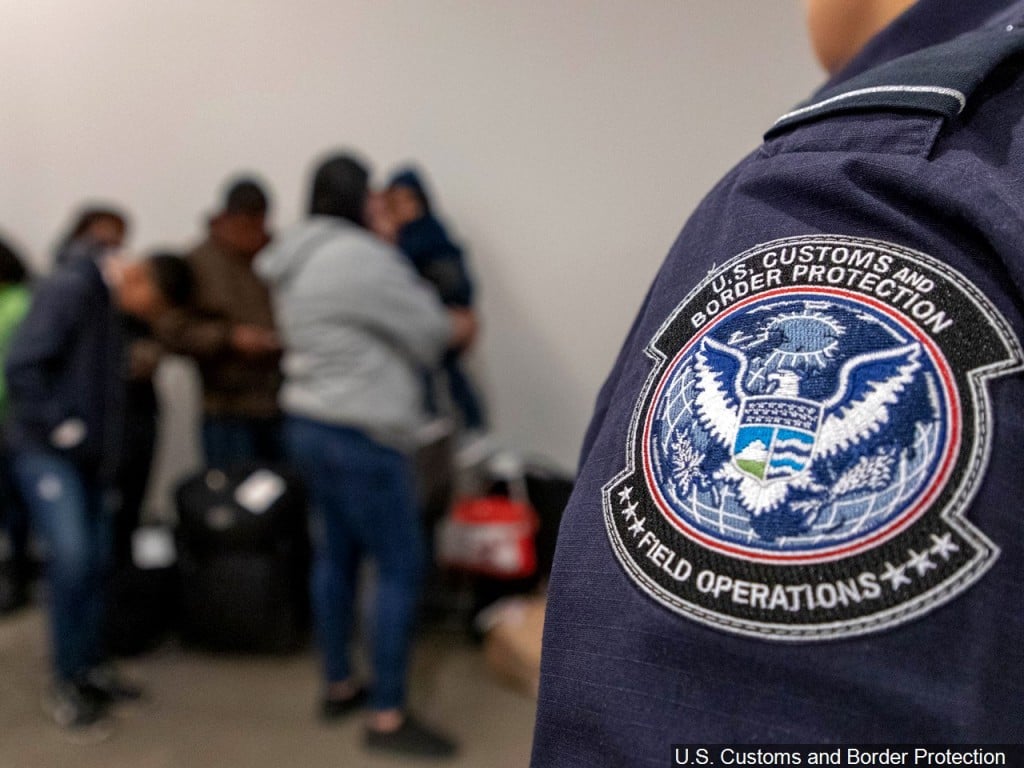 U.S. Customs and Border Protection officers processing immigrants at the San Ysidro Port of Entry in California