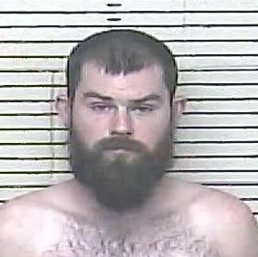 Charged with murder in Carter County and indicted for planning to have three people killed.