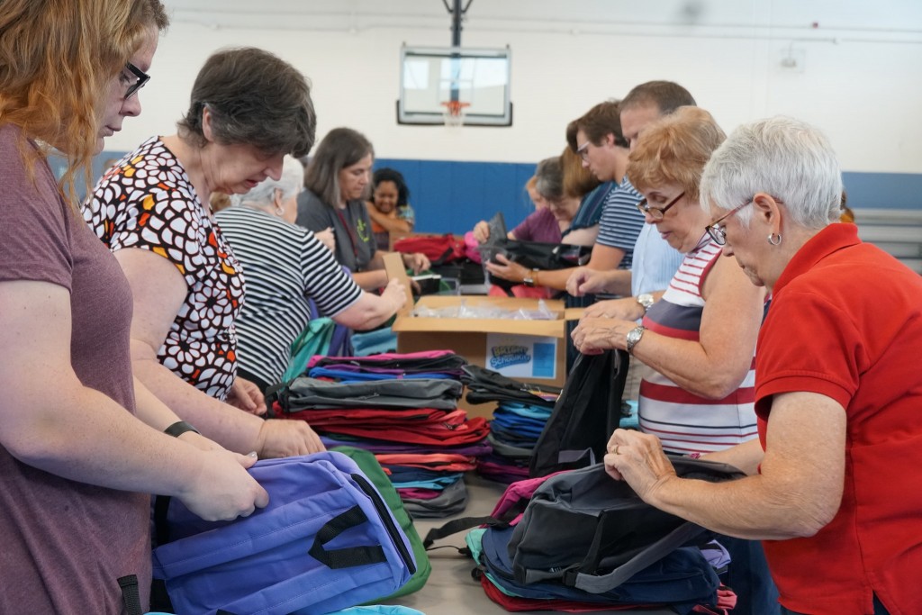 YMCA of Central Kentucky says volunteers gathered Tuesday morning to put together backpacks full of school supplies for students in need.