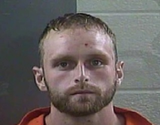 Laurel County man accused of hitting a woman and a child with a baseball bat.