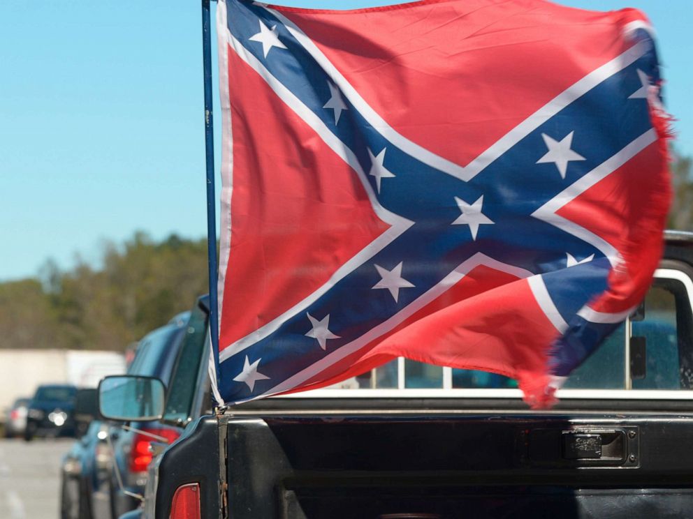 PHOTO: A Confederate flag, attached to the back of a pick up truck, waves in the winds in Georgia.