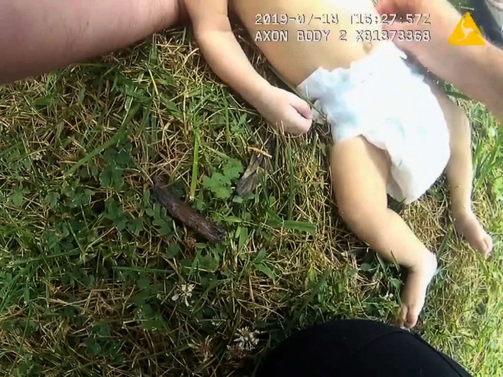 This image made from video captures a police officer performing CPR on a baby.