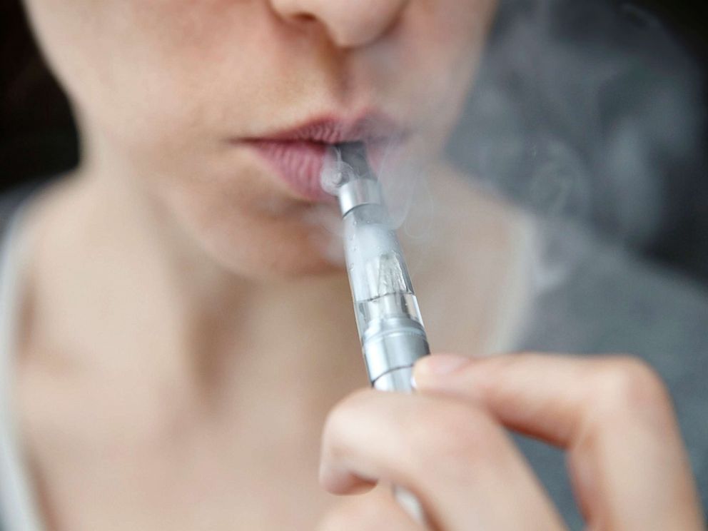 PHOTO: In this undated stock photo, a teen is smoking an e-cigarette.