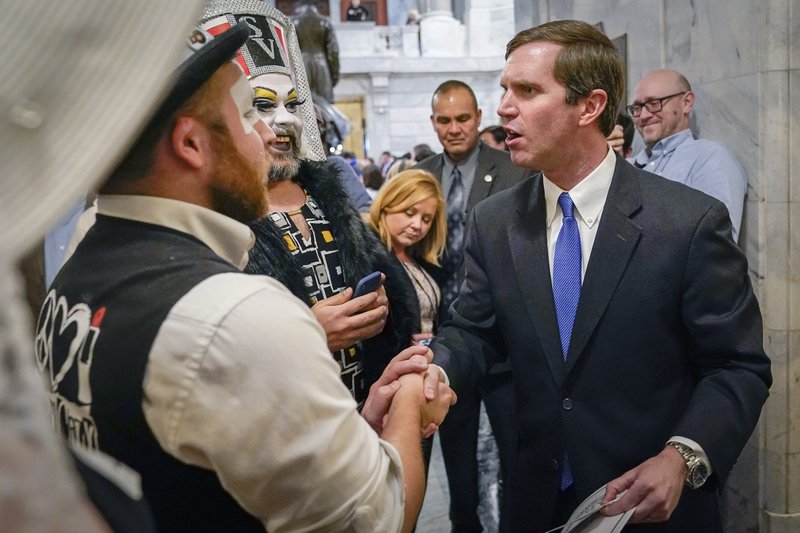 Beshear poses with drag queens
