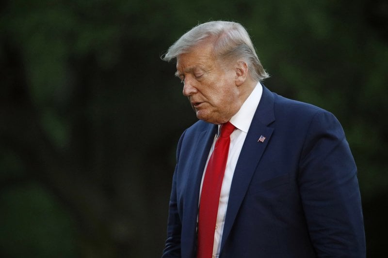President Donald Trump walks across the South Lawn of the White House in Washington