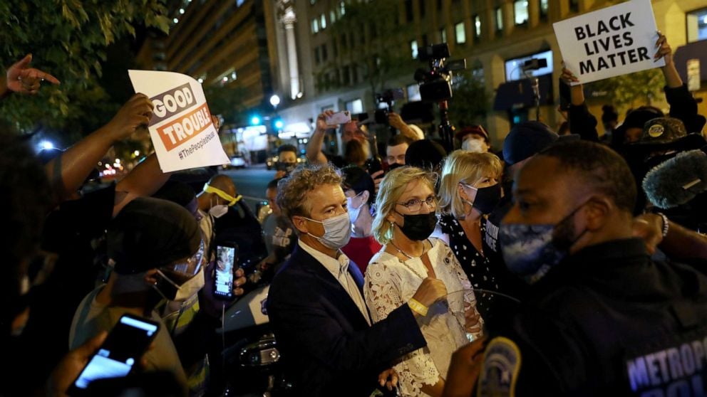 PHOTO: Protesters confront U.S. Senator Rand Paul (R-KY) during a protest in Washington, U.S. August 28, 2020. 