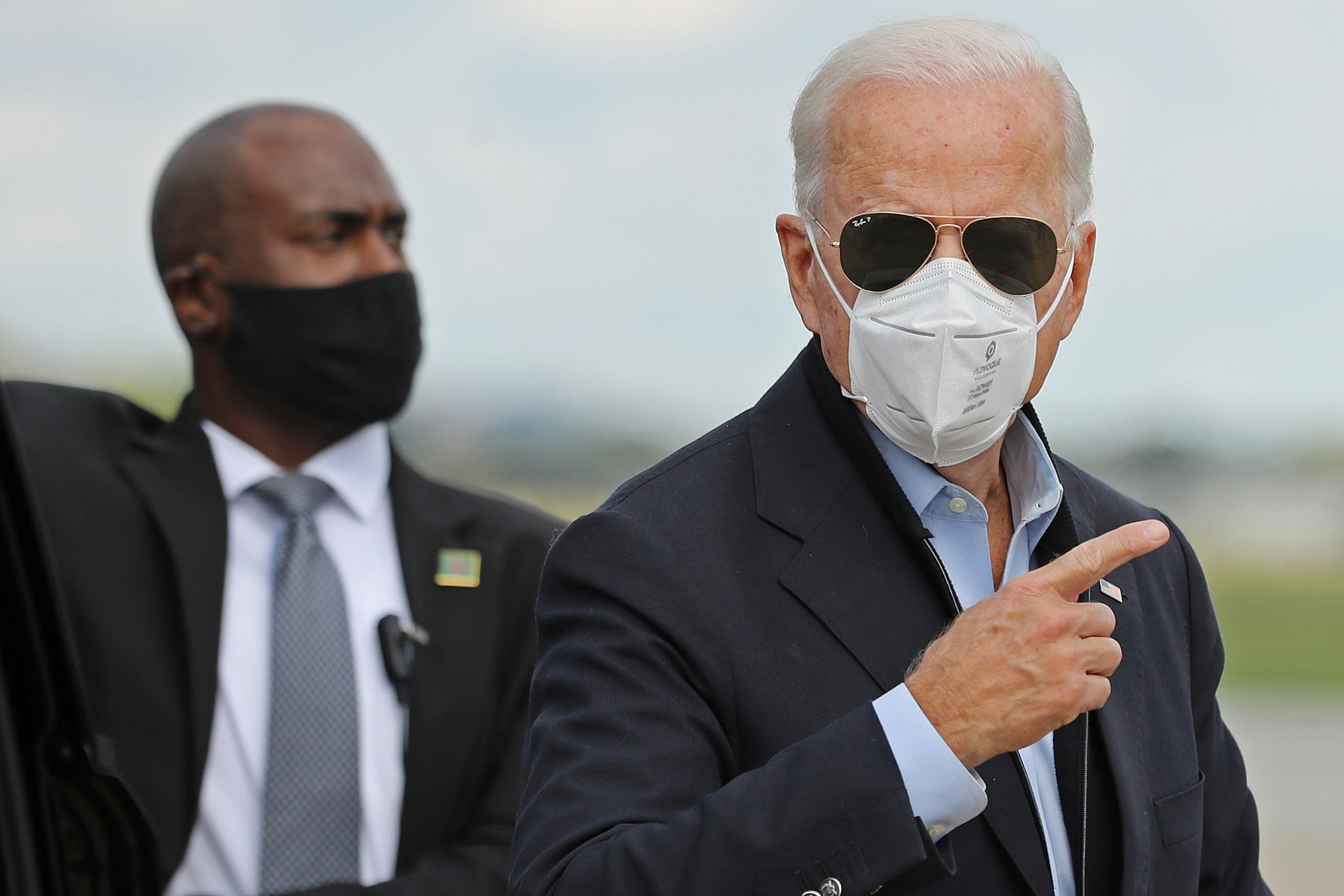 Democratic presidential nominee Joe Biden prepares to board a plane in New Castle, Delaware, on his way to Grand Rapids, Michigan, on October 2.