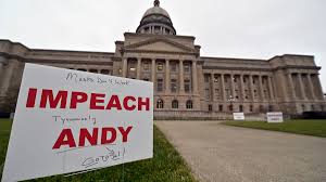 Protesters placed signs outside the State Capitol on 1-5-21 calling for the impeachment of Governor Andy Beshear.  This was opening day of the new legislative session