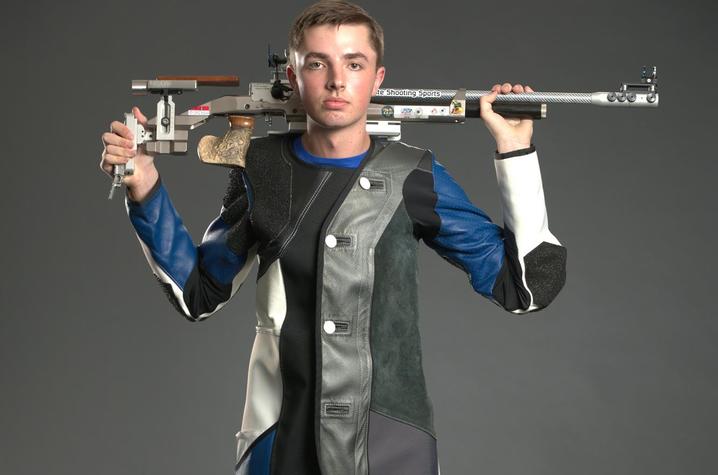 photo of Will Shaner with rifle