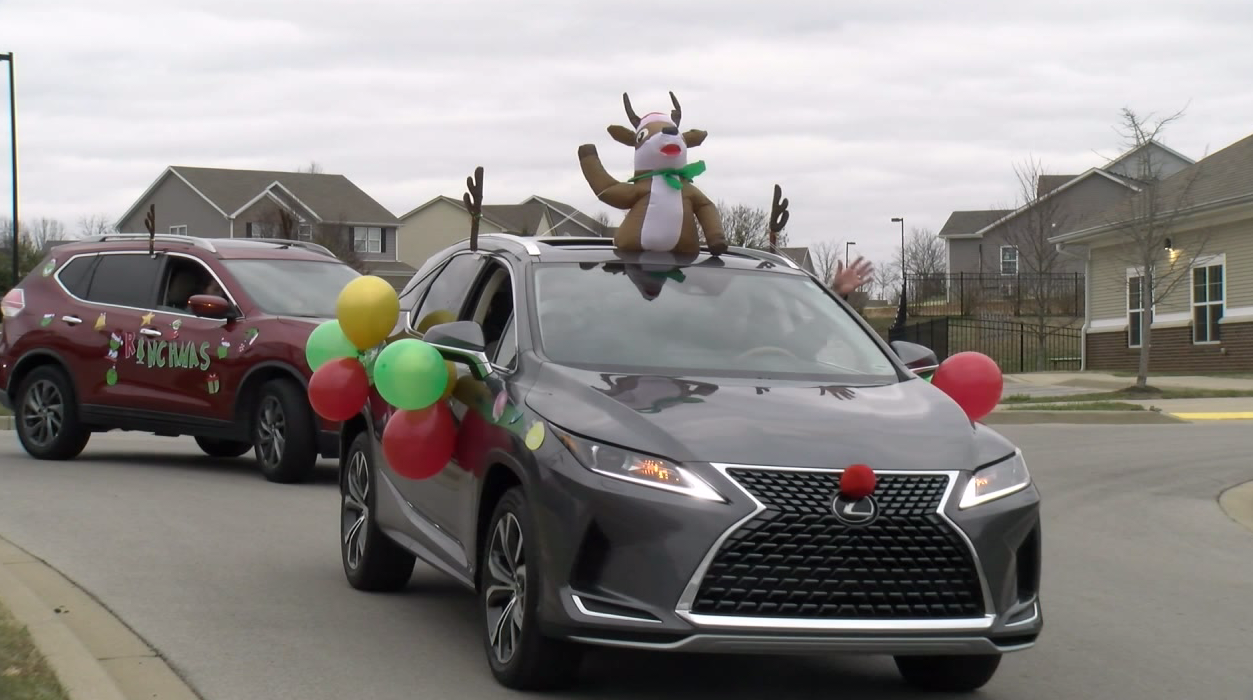 Lexington neighborhood holds drivethru Christmas parade for families