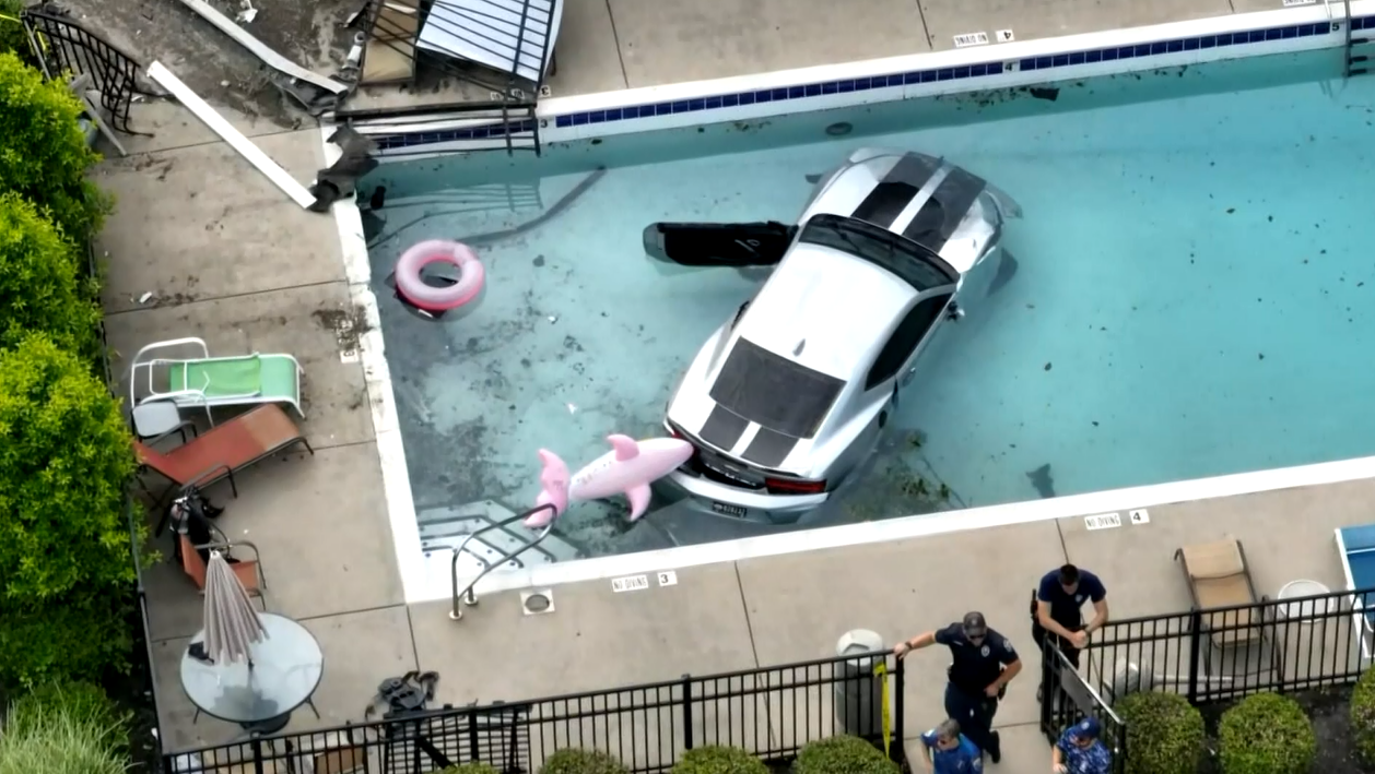 Louisville police: Man shot while driving car, crashes into swimming pool