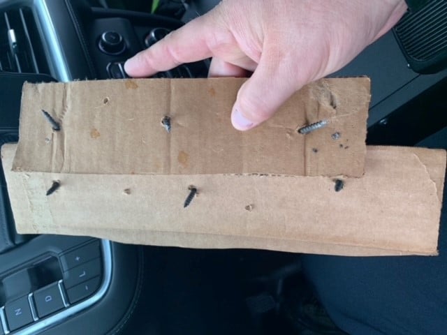 Georgetown Police show cardboard spike strips they say damaged vehicles