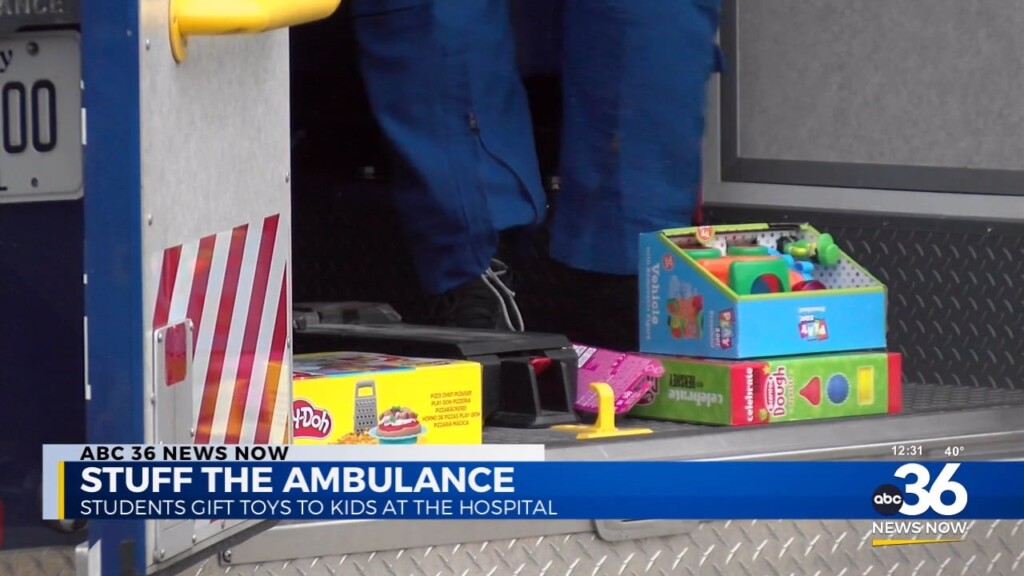 High School Students Stuff Ambulance With Toys