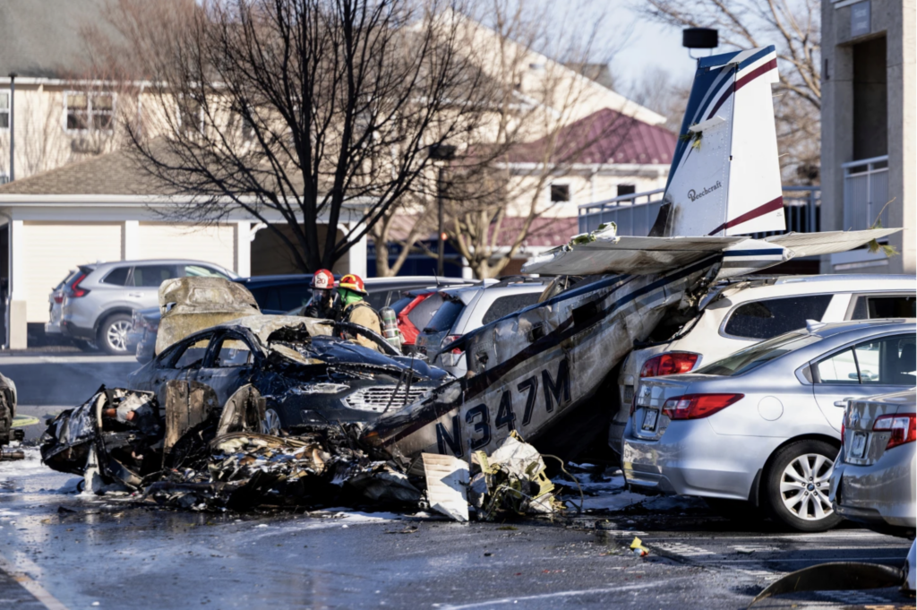 First responders work the scene after a plane crashed in the parking lot of a retirement community in Manheim Township, Pa., Sunday, March 9, 2025. (Logan German/LNP/LancasterOnline via AP)