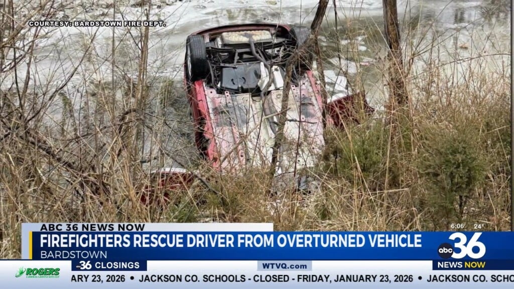 Firefighters Rescue Driver From Overturned Vehicle