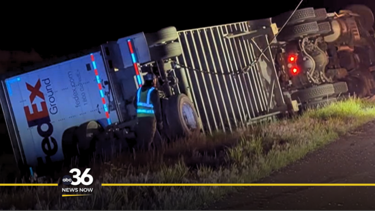 Semi-truck flips over