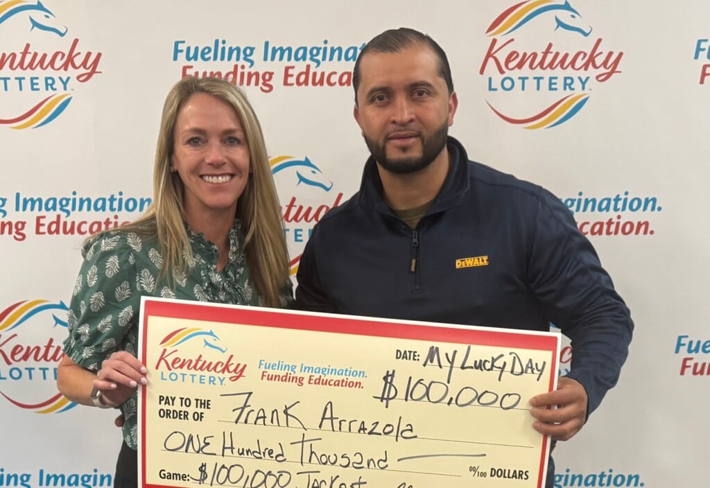 Frank Arrazola With Lottery President And Ceo Maggie Garrison