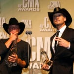 Kenny Chesney And Tim Mcgraw Pose With Their Black Hats And Awards At The 46th Country Music Association Awards In Nashville