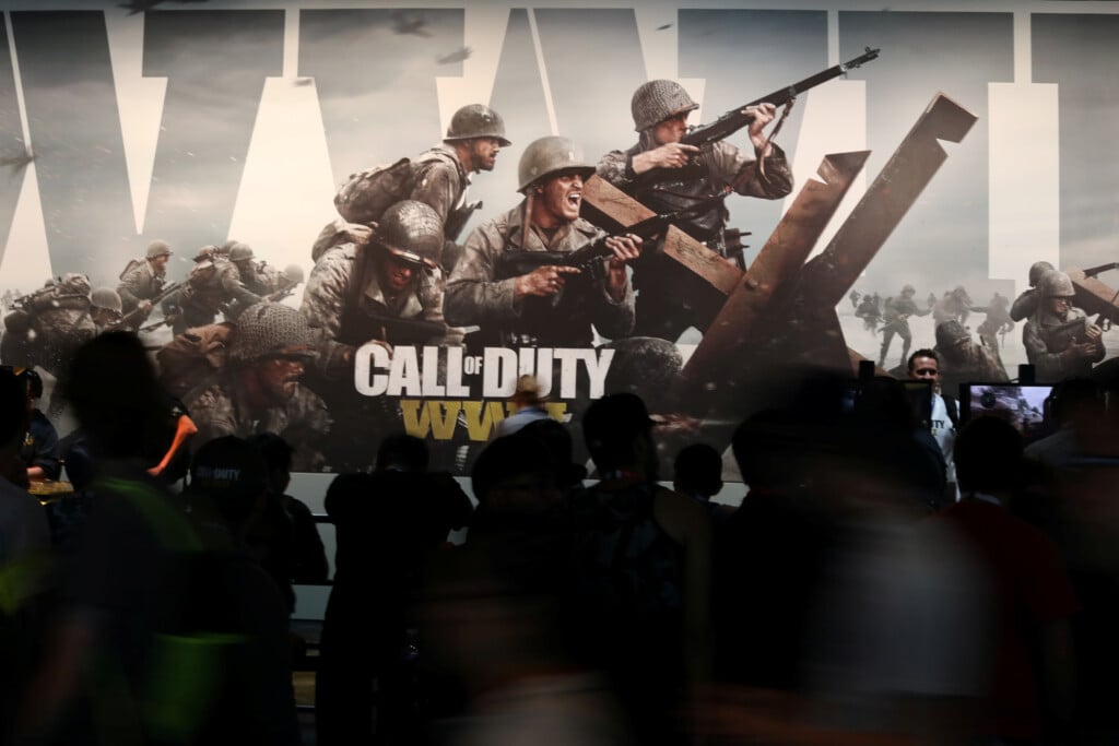 Attendees Walk Past A "call Of Duty" Advertisement At The E3 2017 Electronic Entertainment Expo In Los Angeles
