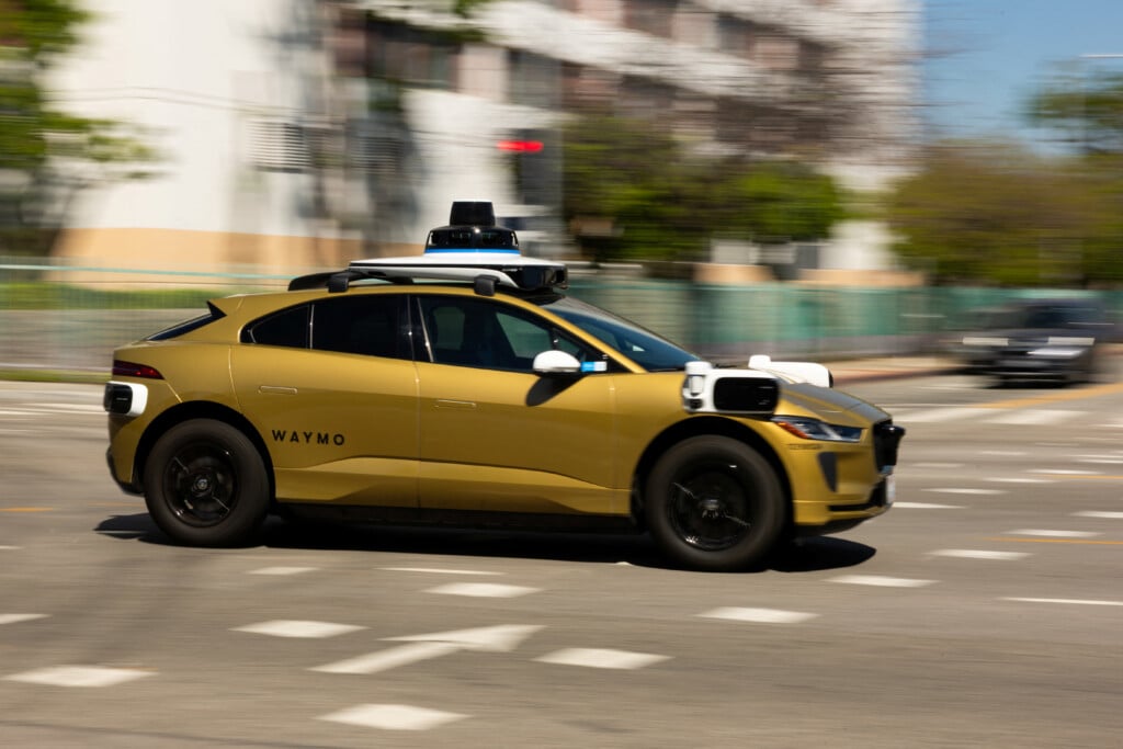 A Golden Waymo Driverless Vehicle Drives In Los Angeles