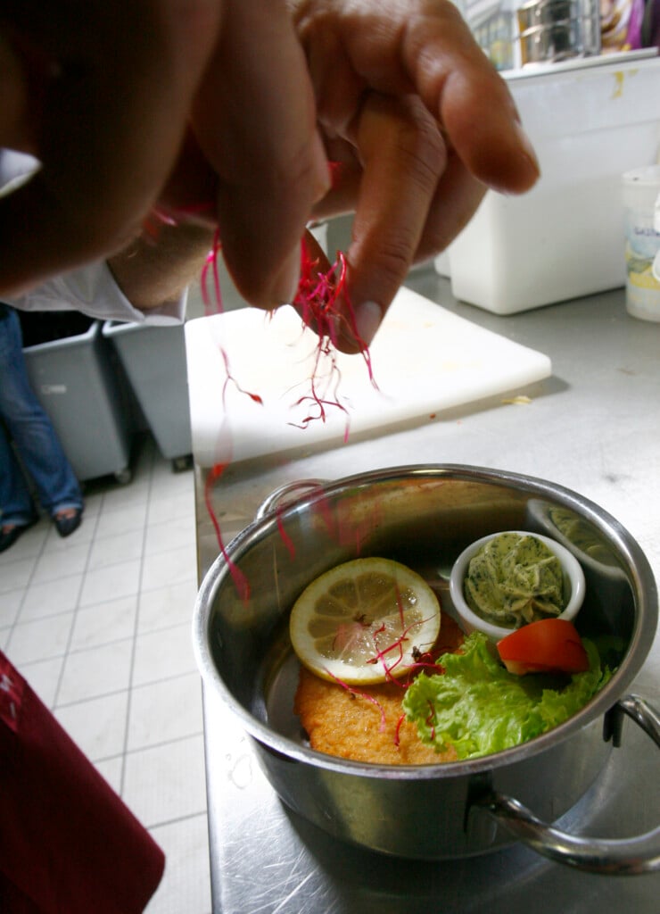 A Cook Prepares A Schnitzel In The Kitchen Of The Newly Opened Restaurant Baggers In The Bavarian City Of Nuremberg