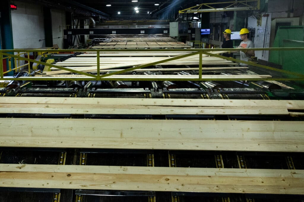Employees Inspect Finished Wood Products On The Production Line Inside The Sawmill At Gorman Bros. Lumber Ltd. In West Kelowna