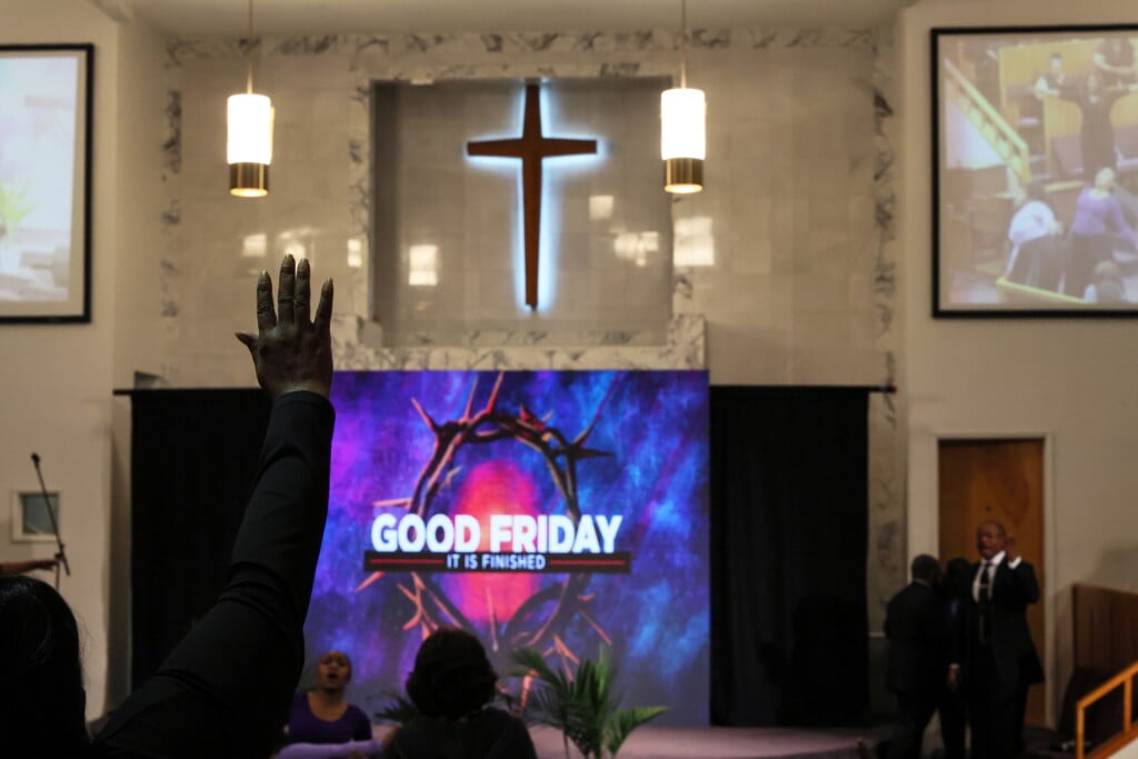 A Woman Raises Her Hand During The First In Person Non Sunday Service During Good Friday At Christ Second Baptist Church In Long Beach