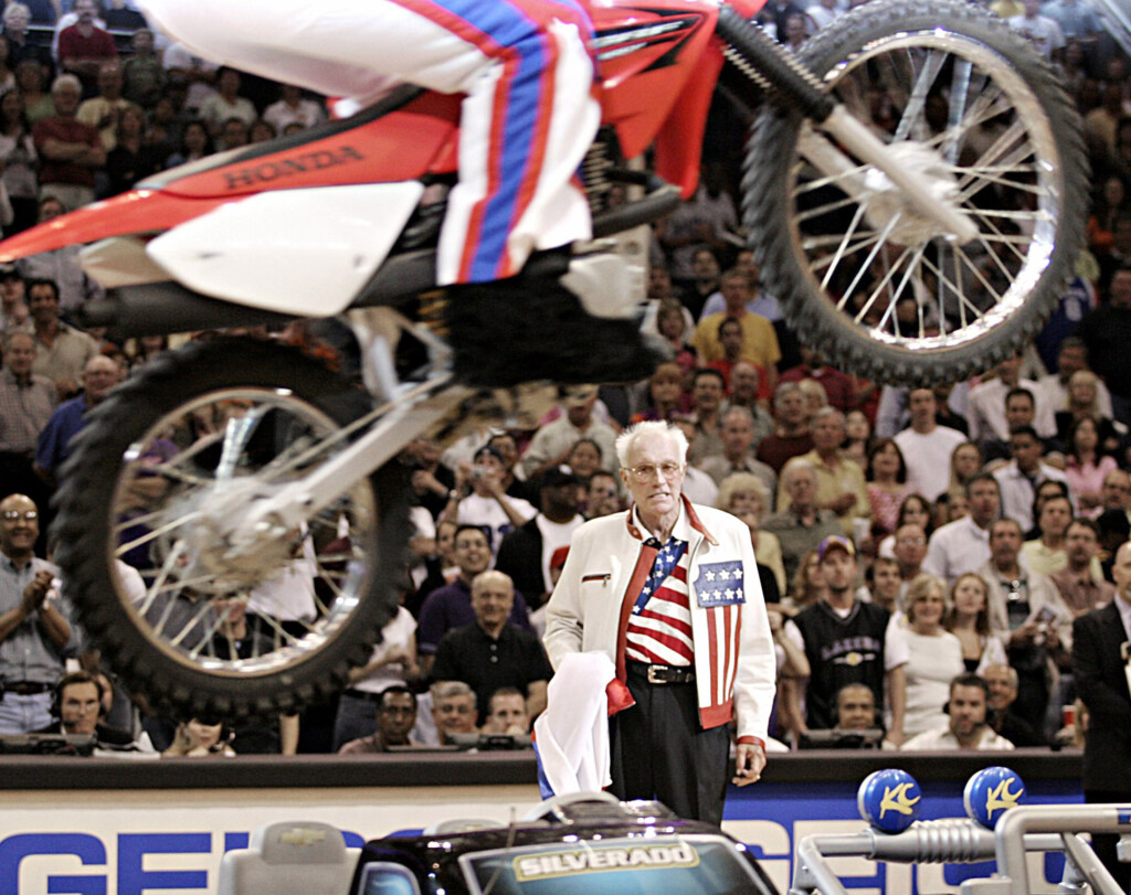File Photo Of Former Motorcycle Daredevil Knievel Watching Person Jumps Toy Cars On Dirt Bike During Timeout Of A Suns And Lakers Nba Game In Phoenix