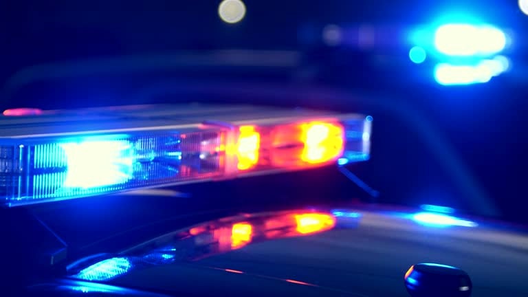Emergency Lights Flashing On Police Cars At Night