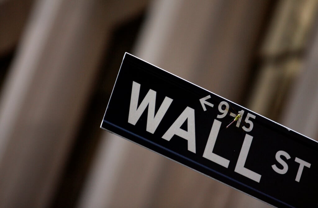 A Dragonfly Is Seen On A Wall Street Sign In New York