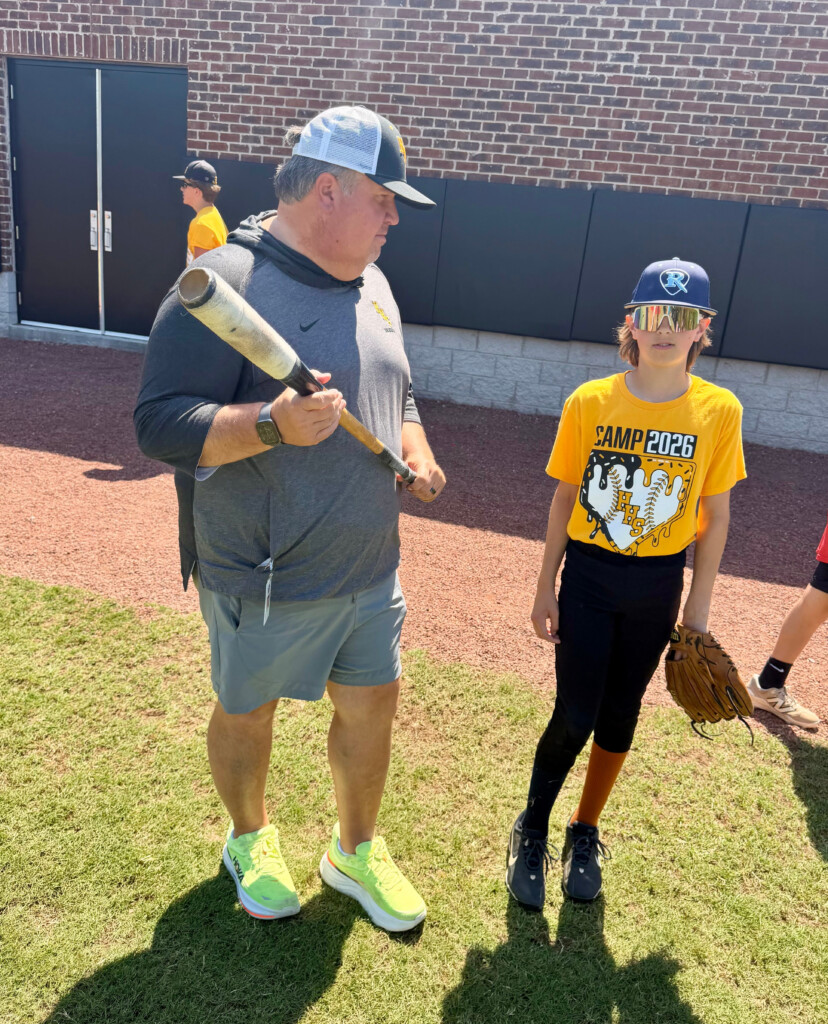 Hendersonville Parks Director Andy Gilley Talks With Rising Seventh Grader Henry Thomas On June 4, 2026, At Drakes Creek Park In Hendersonville, Tennessee, During A Three Day Baseball Camp For Youth. The Boy Was Giving Gilley The Origin Of The Term "the Ki