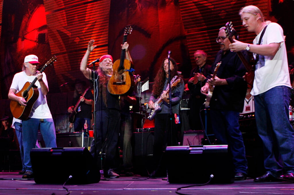 Musician Willie Nelson Performs With Neil Young And Derek Trucks During The 2007 "farm Aid" Concert In New York