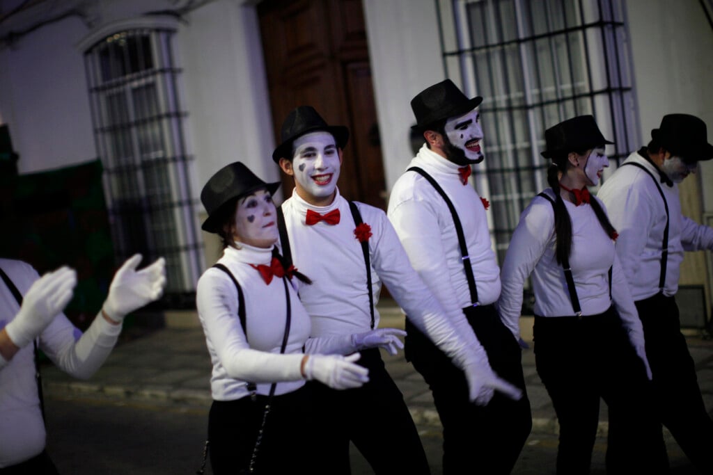 Revellers Dressed Up As Mimes Take Part In New Year's Celebrations In Coin