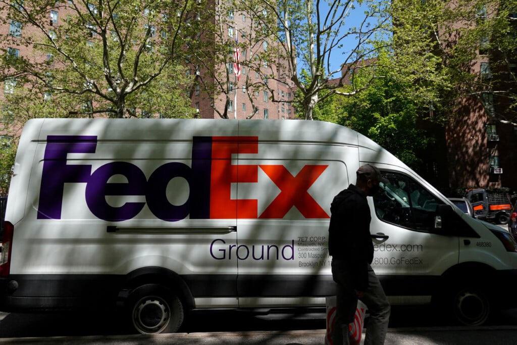 File Photo: A Person Walks By A Fedex Van In Manhattan, New York City