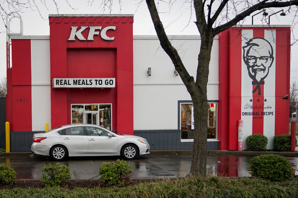 A Vehicle Waits At The Drive Thru Window Of Kentucky Fried Chicken After A State Mandated Carry Out Only Policy Went Into Effect In Order To Slow The Spread Of The Novel Coronavirus (covid 19) In Louisville
