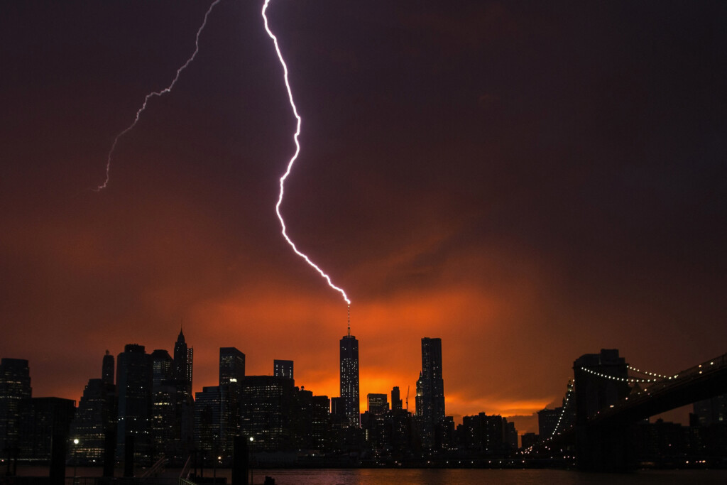 Lightning Strikes One World Trade Center In Manhattan As The Sun Sets Behind The City After A Summer Storm In New York