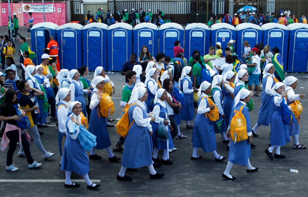 Nuns Walk Past Port A Potties After Pope Francis Celebrated His Final Mass On Copacabana Beach