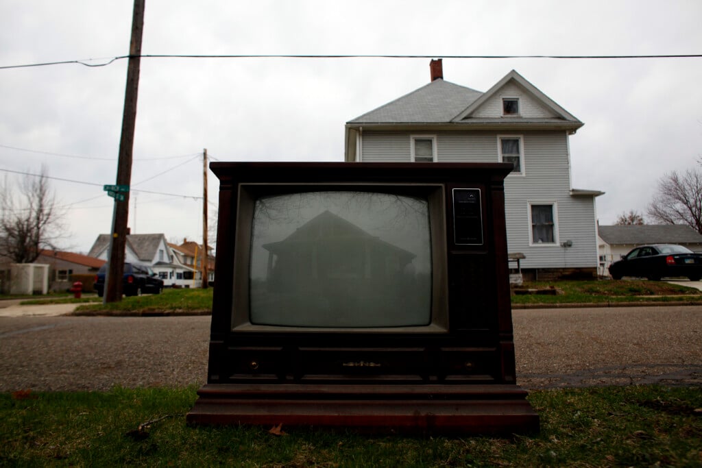 A House Is Reflected On The Screen Of A Discarded Television In Beach City, Ohio