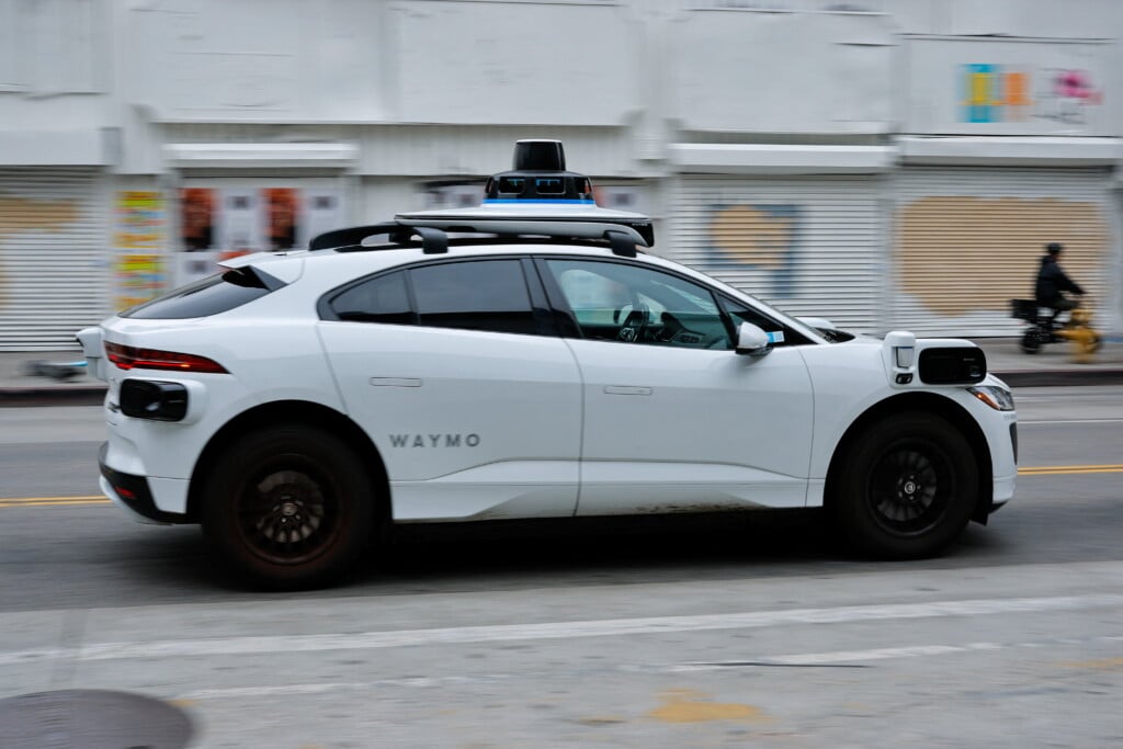 A Waymo Driverless Car Driving In Downtown Los Angeles