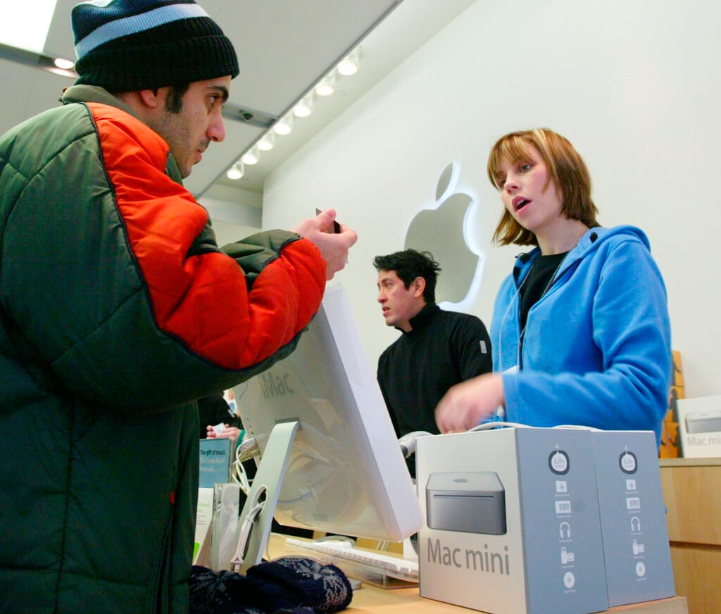 Man Buys A Mac Ini Computer As New Apple Products Go On Sale For The First Time In New York.