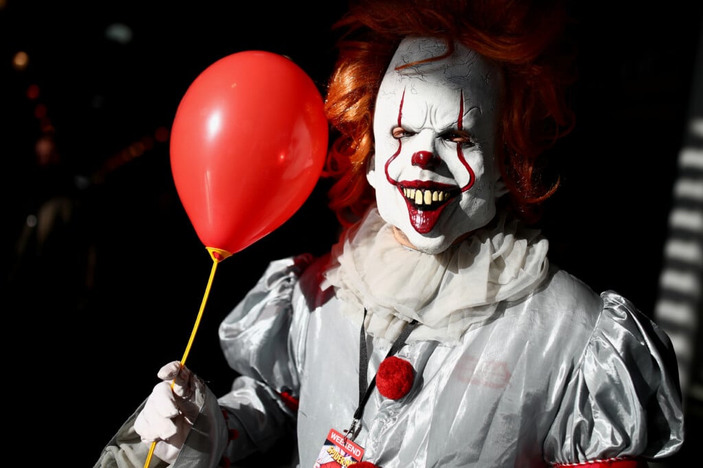 A Cosplayer Costumed As Pennywise The Clown From The Horror Movie "it" Poses During The Vienna Comic Con