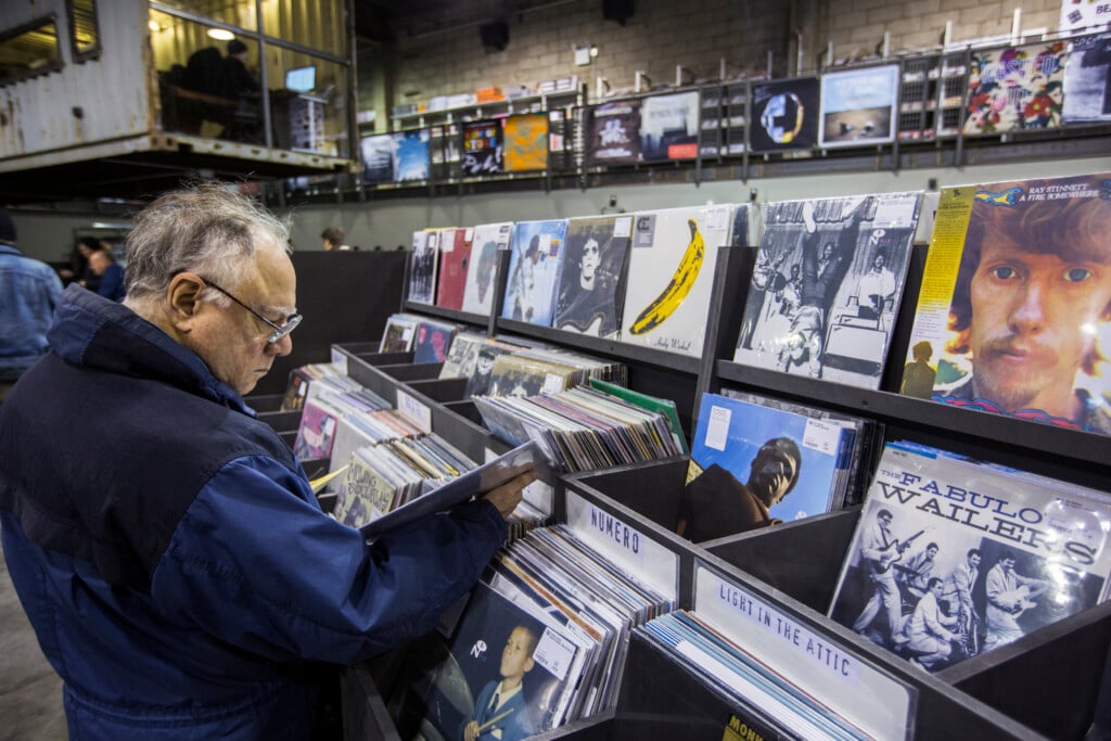 A Man Peruses Albums Displayed Inside Of The Record Store Rough Trade In The Williamsburg Neighborhood Of New York