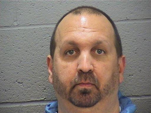 This image provided by the Durham County Sheriff's Office shows a booking photo of  Craig Stephen Hicks