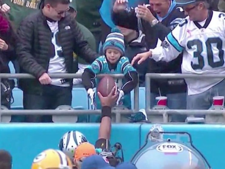 Boy who recently lost father gets game ball from Cam Newton. (Courtesy: wset.com)