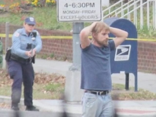 Edgar Welch surrendering to police on December 4