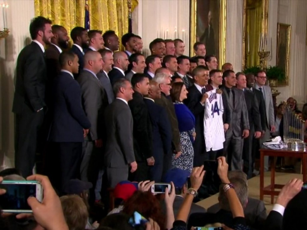 President Barack Obama holds a #44 jersey as he poses with the World Series Champion Chicago Cubs during the team's visit to the White House on Jan. 16