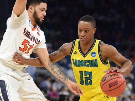 UNCW's C.J. Bryce looks for space against Virginia during a NCAA East Regional game on March 16